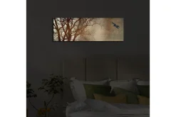 Lerretsbilder|Lerretsbilder-Lerretsbilde med LED-belysning 30x90 cm - Silhuett av et tre med en fugl i flukt mot en mykt tonet bakgrunn Flerfärgad