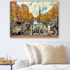Lerretsbilder|Lerretsbilder-Lerretsbilde 70x100 cm - Sykler ved en kanal i Amsterdam omgitt av høstfarger Flerfärgad